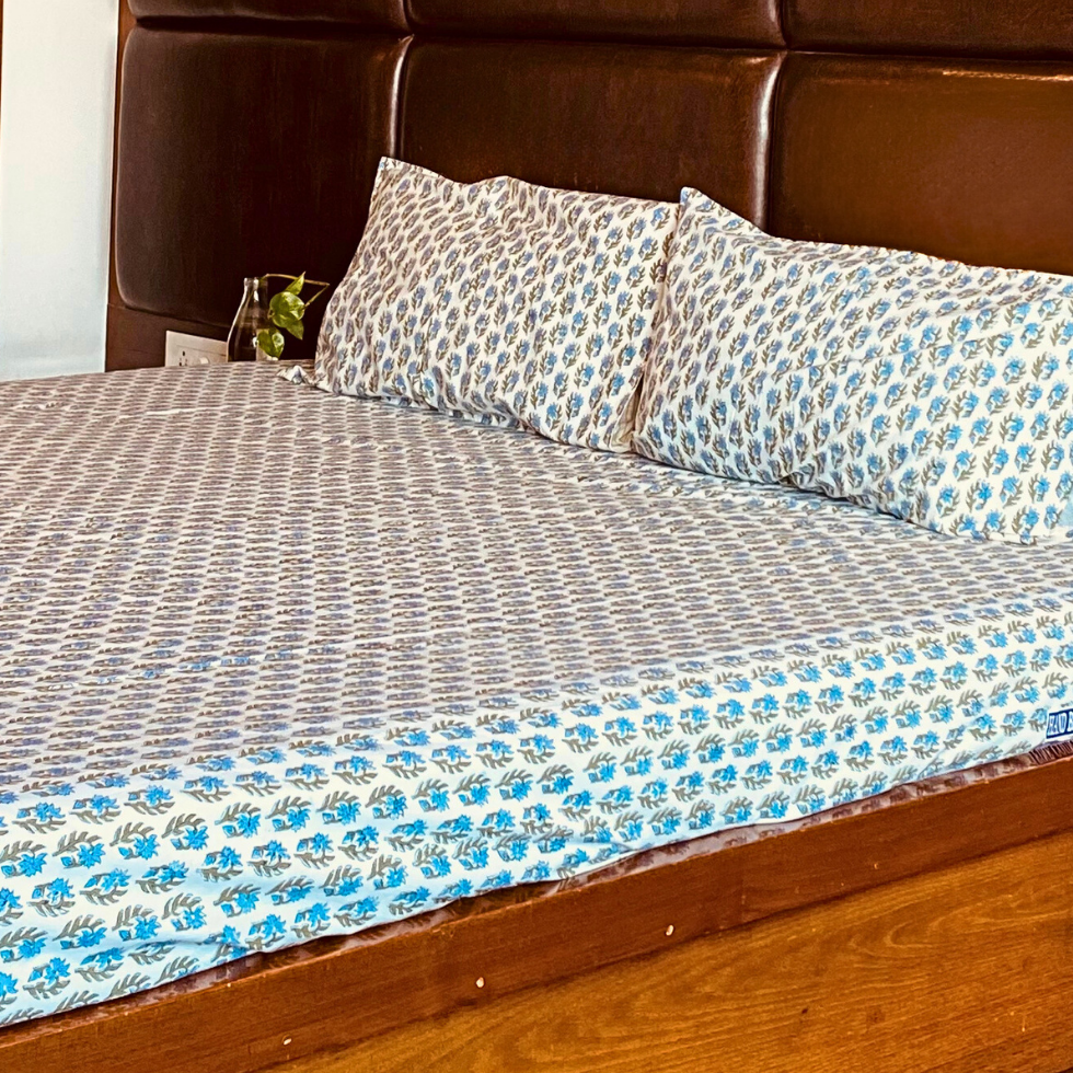Ocean Bloom hand block printed bedsheet styled on bed, Sanganer block print